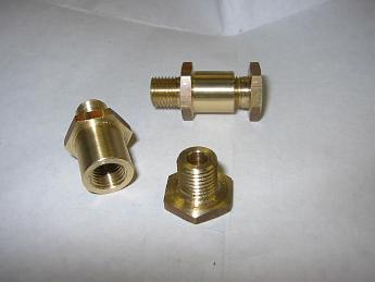  28-Nov-04 Nice shiny brass stuffing boxes for the valves.  It was 3-day holiday weekend and the big mill was tied up, so I looked around for a lathe project. All four parts only took about four hours of shop time, with no scrap parts...maybe I'm learning....